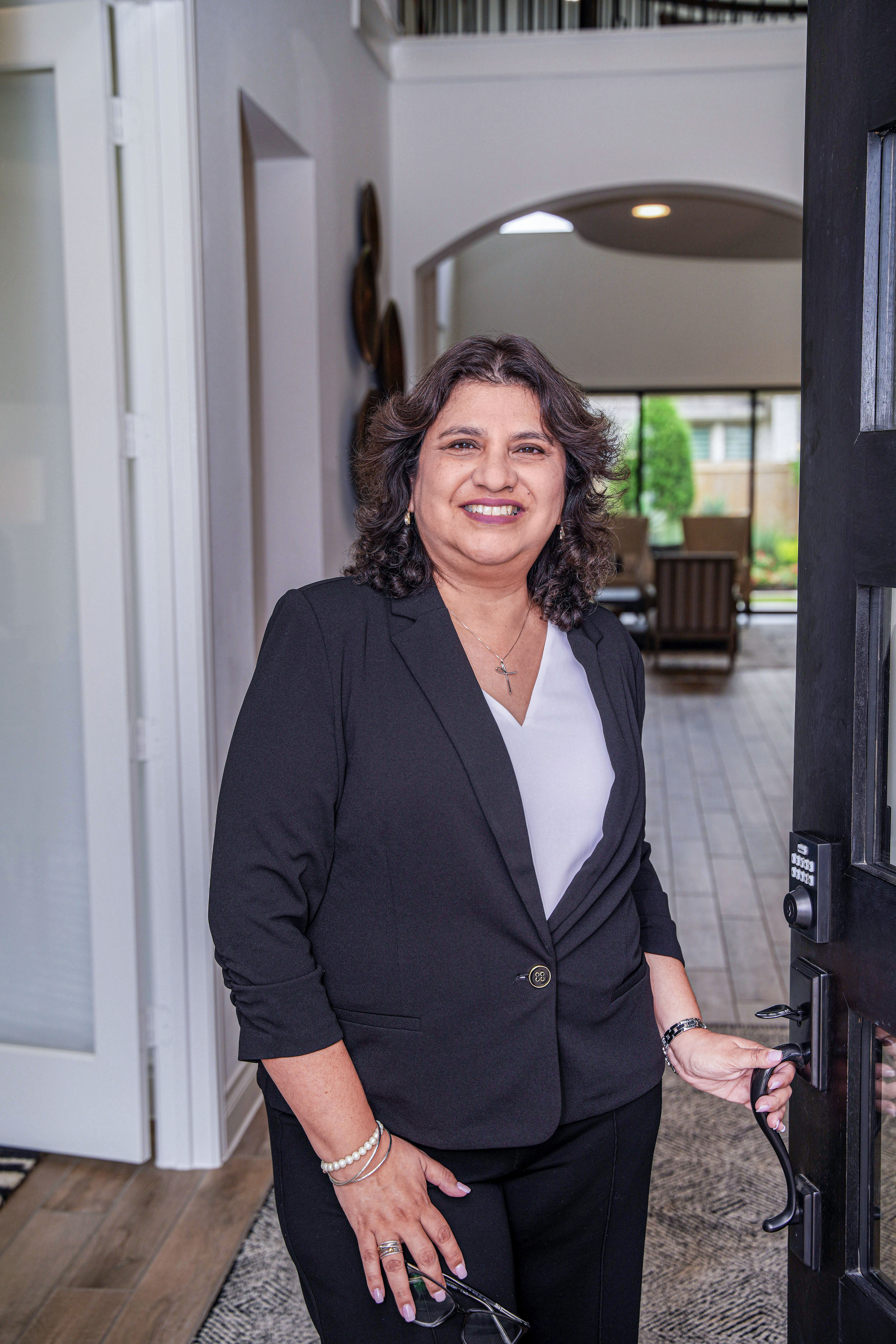 Veronica welcoming clients at the front door